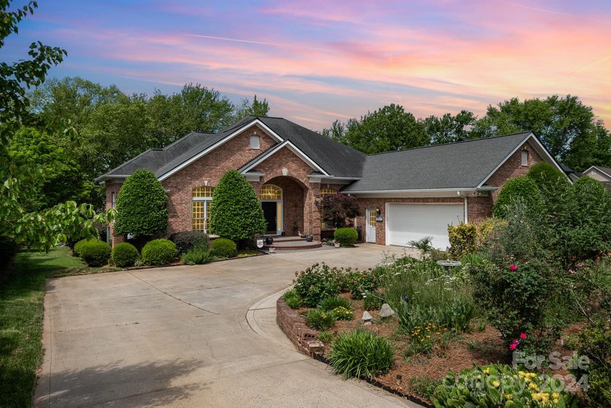 Waterfront paradise on the shores of Lake Norman! Spanning an impressive 3,654 sqft. Step inside to an open floor plan. Home boasts a spacious kitchen, great room, dining room, office, living room,  primary bedroom with en-suite bathroom and walk-in closet. 2 Secondary bedrooms include their own private bath providing ample space for family and guests setting the stage for a truly serene lifestyle. Convenience meets style with a two-car garage featuring built-in cabinets, while the yard is equipped with in-ground irrigation for easy maintenance. Outside, a patio sets the scene for cozy evenings spent under the stars on this level lot. Waterfront access is a breeze with your own private deck, dock, and boat lift, offering endless opportunities for boating, fishing, paddle boarding, and enjoying the serene waters of Lake Norman. Indulge in lazy afternoons on the sandy beach, soaking up the sun and embracing the waterfront lifestyle at its finest. Showings start Saturday May 11th.