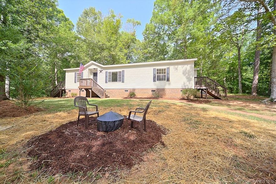 SELLER PAID CLOSING COSTS!**  Enjoy peace, quiet & nature on this 1.5 acre private wooded lot in a completely renovated 3BR/3BA! Step inside this open floor plan & imagine yourself fixing meals in the gorgeous kitchen featuring new stainless steel appliances, refinished cabinetry, new counter tops & a versatile island. Sparkling bathrooms, upgraded trim package, new flooring, carpet, fresh paint, lighting, 6 panel interior doors & fixtures throughout. Newer AC, low SC taxes new well pump/tank.