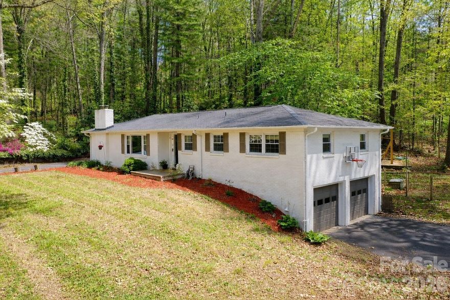 No HOA fees! Prime location! Private setting.  Move-in ready with room to grow.  Beautifully updated full-brick ranch ideally located just minutes from everything Hendersonville has to offer, with easy access to I-26 for a convenient commute to Asheville or the Upstate. Spacious and bright dining room and cozy family room with upgraded built-ins provide multiple gathering areas, while the updated kitchen features built-in details and a breakfast bar perfect for everyday living or entertaining. Dining room has potential to use as an additional den area. Hardwood and tile flooring add warmth and durability throughout the home. The large unfinished basement with interior and exterior entry, garage door access, and workshop space offers incredible potential — whether for storage, hobbies, or future expansion. A two-car basement garage provides ample parking and convenience. Outside, you will enjoy the private yard, complete with patio and pergola — a perfect setting for evening cookouts or quiet mornings surrounded by nature.