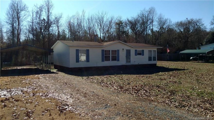 Great one level home in the New London area near Badin Lake and Morrow Mountain State Park! 3 bedrooms, 2 baths, large kitchen and dining area, living room with fireplace, 2 carports, and 2 nice storage buildings. Great buy at $69,000!