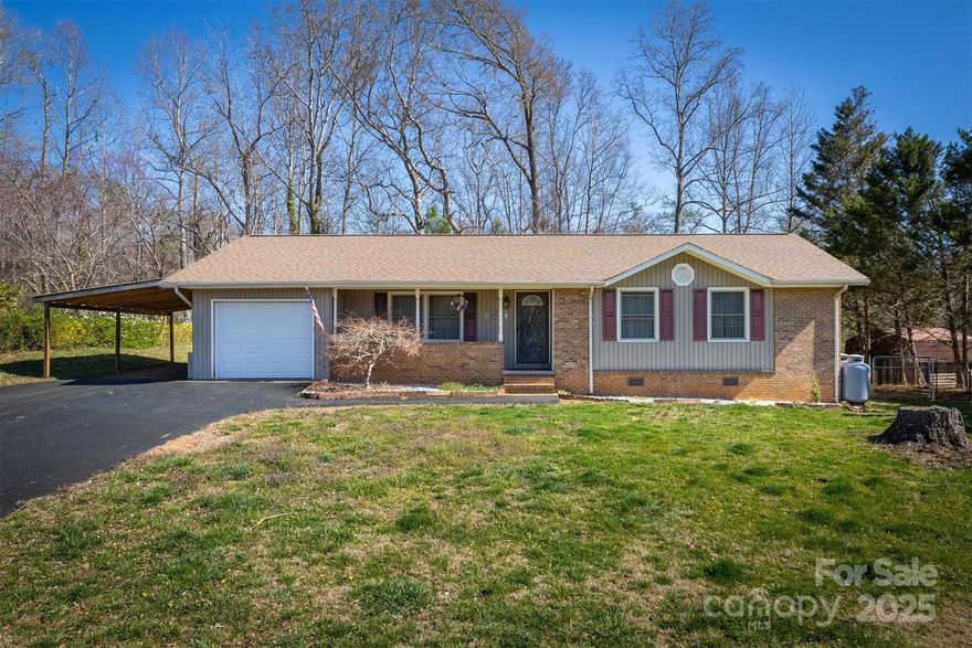 Updated 3-bed/1.5-bath ranch-style home with garage in a great location close to Downtown Morganton and Lake James! Updates to the home include a 30-year roof, replacement windows, HVAC, slate appliances, countertops, and more. The full hall bath has been fully remodeled with a stylish tiled tub and walls. The primary bedroom offers a private half-bath. Off the dining room, there is a spacious screened-in poured patio overlooking the backyard. Real hardwood floors run throughout most of the home. Outside, enjoy the level backyard with two storage buildings and a partially fenced-in area.