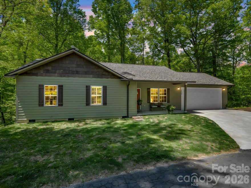 Tucked away on 1.37 private acres, this newer one-level home offers the perfect balance of quality, comfort, and location.  Designed with easy living in mind, this 3-bedroom, 2-bath home features an open floor plan filled with natural light and seamless flow-ideal for both everyday living and entertaining. High-quality finishes are evident throughout, from engineered hardwood floors to a thoughtfully designed kitchen with leathered granite countertops and custom cabinetry.  The exterior is built to last with durable smart siding, while a Trane heat pump ensures efficient, year-round comfort.  A spacious two car garage adds convenience, and the one-level layout makes this home as functional as it is beautiful.  Enjoy the peace and privacy of your surroundings while being just minutes from outdoor adventure near Dupont Forest and only 15 minutes to downtown Brevard.  Homes like this don't come along often- where quality craftsmanship meets a lifestyle rooted in nature and simplicity.