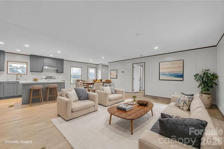 BRAND NEW 2026 three bedroom, two bathroom Clayton home offers 1,500 HSF and is situated on a cleared, level lot in the quiet countryside off Hwy 18 in Connelly Springs. Features include charming post and beam covered front porch, brick skirting, low maintenance vinyl siding, and a wall of mature trees in the backyard for privacy! Inside, the open floor plan offers LVP flooring, living room opening into the kitchen, which features all appliances, center island, stainless appliances and adjoining dining area. The split bedroom layout offers two bedrooms sharing a full bath on one end, a bonus room/office, and a private primary suite with huge walk-in closet and full bath on the opposite end of the house. Large utility/mud/laundry room. Seller offering $3,000 closing costs assistance with acceptable offer.