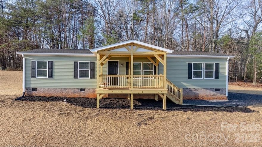 BRAND NEW! Completed in 2026, this three bedroom, two bathroom home offers 1,500 HSF and is situated on a cleared, level lot in the quiet countryside off Hwy 18 in Connelly Springs. Features include charming post and beam covered front porch, brick skirting, low maintenance vinyl siding, and a wall of mature trees in the backyard for privacy! Inside, the open floor plan offers LVP flooring, living room opening into the kitchen, which features all appliances, center island, stainless appliances and adjoining dining area. The split bedroom layout offers two bedrooms sharing a full bath on one end, a bonus room/office, and a private primary suite with huge walk-in closet and full bath on the opposite end of the house. Large utility/mud/laundry room. Seller offering closing costs assistance with acceptable offer.