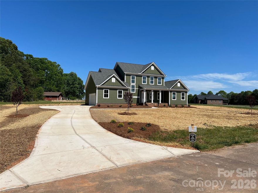 Welcome to The Legacy Plan, beautifully positioned on a 1.29-acre flat lot in a peaceful, open rural setting with long views and plenty of breathing room. This property offers a rare combination of scenic surroundings, a large, flat lot, and everyday convenience to Newton, Conover, Hickory. On the Denver / Charlotte side of Newton. Inside, the open-concept design features 9-foot ceilings on the main level, abundant natural light, and quality finishes throughout. The kitchen showcases upgraded cabinetry, Level 2 quartz countertops, undermount sinks, and a full stainless appliance package including refrigerator, range, microwave, and dishwasher. The primary suite includes a tile shower and spacious walk-in closet, while an upstairs bedroom with a private ensuite bath and walk-in closet provides excellent flexibility for guests, multigenerational living, or added privacy. Additional highlights include tile flooring in full baths, premium LVP flooring, plush carpet in bedrooms, ceiling fans, built-in laundry shelving, WiFi-enabled thermostat and garage door opener, 30-year architectural shingles, and a 10x10 rear patio. With no HOA, no monthly dues, and minimal restrictive rules, you’ll have the freedom to enjoy your home your way. If you’ve been looking for new construction with quality finishes, a large flat lot, and a wide-open setting, this one stands out.

Pictures and 360 tour coming soon!