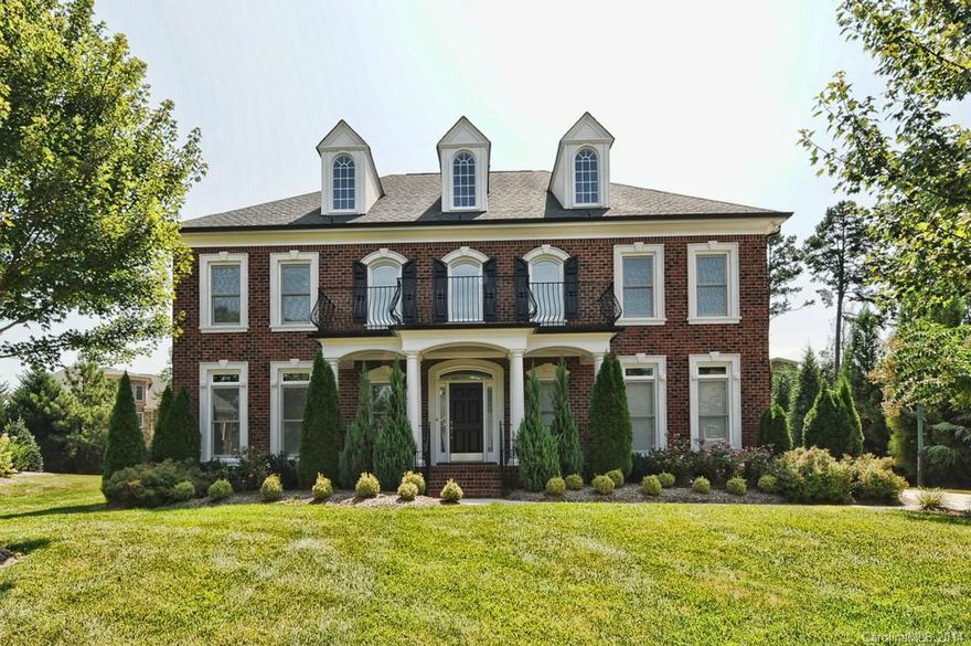 Popular Windsor plan features gorgeous hrdwd floors. 2Sty Gr Rm w/stone fp, chef's kit w/ Jenn Air gas cooktop & Kitchen Aid SS appliances, granite countertops, plus 2 pantries! Private guest suite on main level. Spectacular master suite w/office. All upstairs bedrms boast closet systems. 3rd level rec room w/wet bar & fridge, half bath, media rm, & walk-in-attic. Level fenced backyard w/paver patio & Bose speakers. Move-In-Ready!