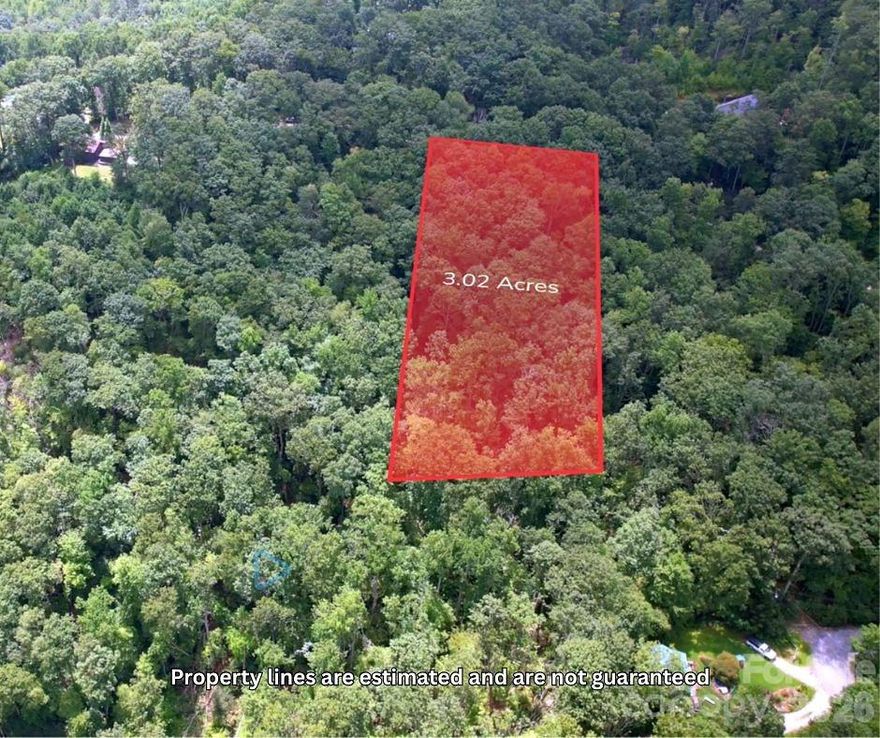 Nestled at the pinnacle of the serene Nubbins Nob community, this private, wooded lot offers stunning potential for long-range mountain views—an ideal setting for your dream home. Towering hardwoods, native rhododendron, and striking natural boulders create a picturesque mountain landscape, blending privacy with natural beauty. Enjoy easy access to Hendersonville and surrounding areas, all while feeling miles away from it all. An affordable opportunity to bring your vision to life in a truly tranquil setting. All roads in subdivision are schedules to be paved early 2026.