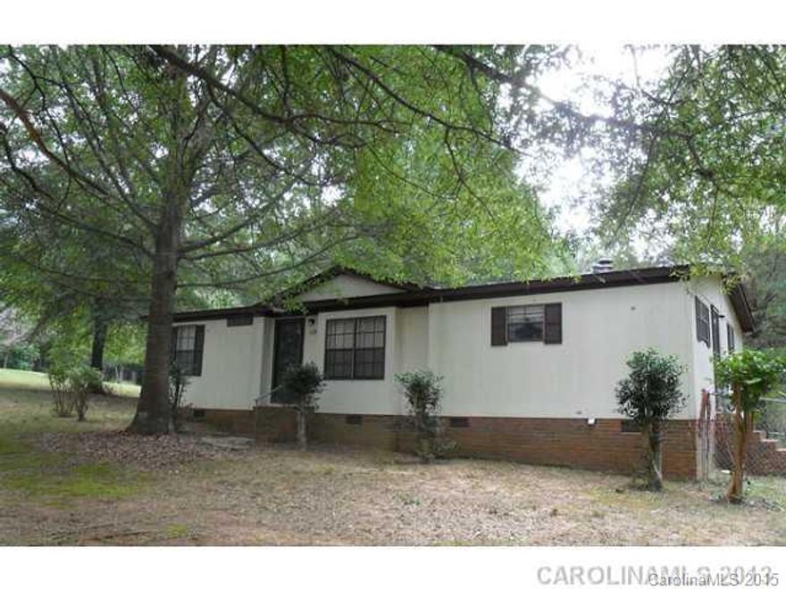living room, kitchen and dining is open area, split bedroom plan, laundry, fenced yard, outbuilding