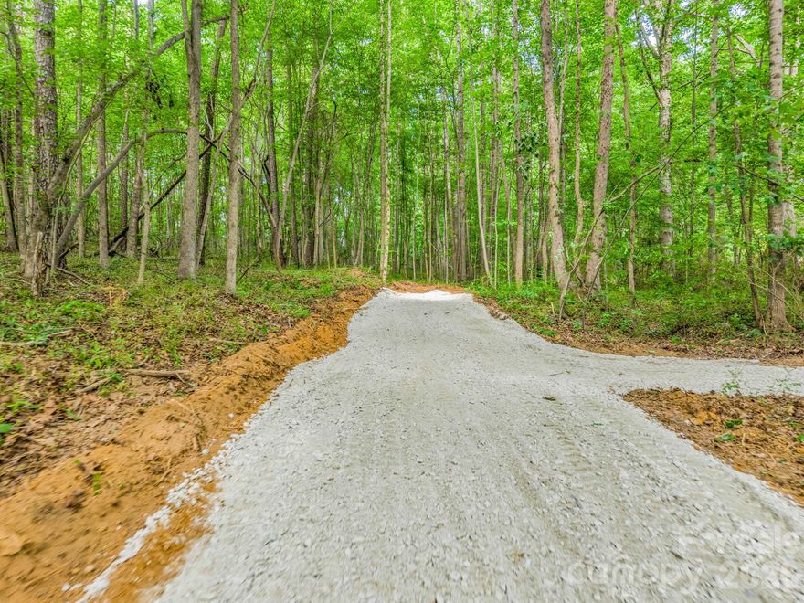 This 9.23-acre property in Shelby, NC, is a rare find, offering a blend of natural beauty and development readiness. Its prime location near Moss Lake and the Catawba Two Kings Casino makes it an ideal spot for a private estate, recreational getaway, or investment opportunity. Full of natural beauty, this level to gently rolling property has a mix of mature trees and level topography with multiple great building sites. Improvements include a brand new drive extending to each of the three lots perfect for building your dream home, horse farm or even multiple investment homes.  A new septic permit is also on file, and with the ability to tap onto county water, this property is ready for whatever your imagination holds.  Catawba Two Kings Casino is now open and conveniently located less than 20 minutes away.  Moss Lake, with camping, fishing and various events offered throughout the year, is less than 10 minutes away.  Don't miss your opportunity to make this piece of paradise your own.