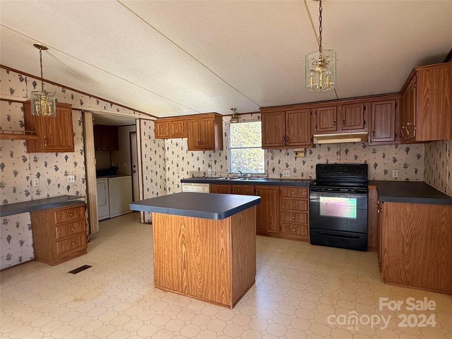 Calling all investors and thrill-seekers! This 1997 Fleet mobile home is your next adventure! Nestled on 2 acres of prime Buford real estate, this fixer-upper is a diamond in the rough with endless potential.  With a little TLC and a great lawn mower you can turn this spacious 3 bedroom, 2 bath property into a HOME.  Regardless if you're looking to add to your fleet of rentals or looking to make this your humble abode -  Just remember to bring your  lawnmower, and a healthy dose of humor. And maybe a tetanus shot as you work through your very own jungle paradise.  But hey, at least you'll have plenty of fresh air, a great view of the local wildlife, and a mystery building hidden somewhere in the overgrown weeds.  Unleash the thrill-seeker within and let this home be your next adventure.  Cash only, folks.  No credit cards accepted.  This is a cash-only deal for the adventurous at heart.  Property to be sold is, where is, how it sits.