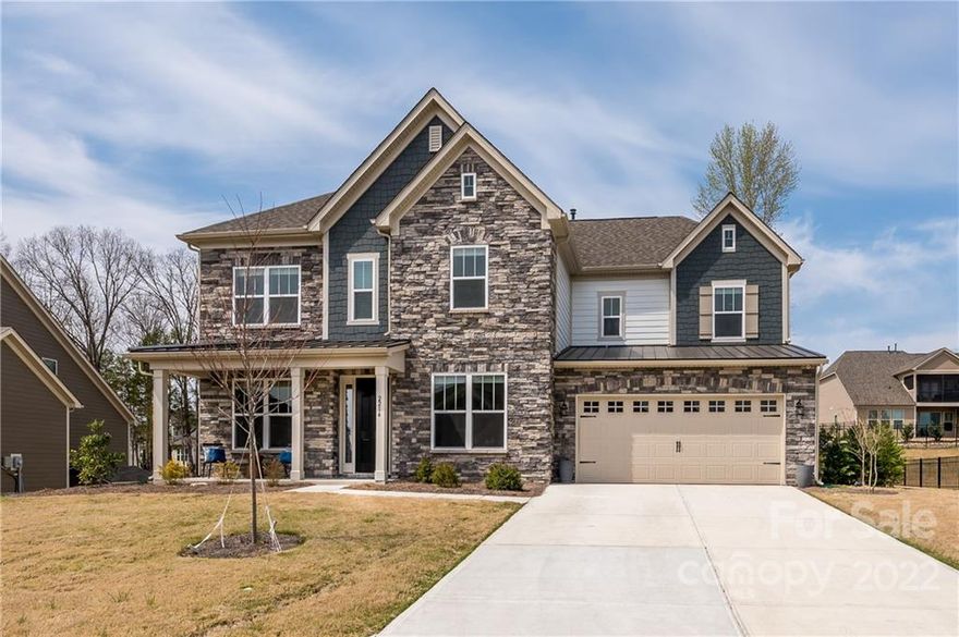 So pretty you would think it was a model home! This lovely home in the popular upscale Bent Creek community has it all. Highly sought-after schools, wonderful neighborhood amenities & fresh modern features on every buyer’s wish list. Features include an open floor plan filled w/natural light & rich hardwood floors. On the 1st floor: a huge chef's kitchen w/large Island, quartz counters, apron sink, gourmet cabinets, & gas range w/glass hood; guest bedroom w/full bath; family room w/floor to ceiling stone fireplace & cedar mantel; sunroom overlooking backyard; dining room w/butler’s pantry; & office w/French doors.  Upstairs is the primary bedroom/bath retreat w/tray ceiling, soaking tub, frameless shower, & enormous closet connected to laundry room. Plus 2 good sized bedrooms & bonus room. Enjoy outdoor living in lovely backyard w/built-in fire pit & stone patio. Plus community pool, clubhouse, fitness center, playground & walking trail. Indian Land Location w/Lancaster Mailing address