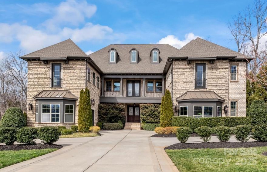 This magnificent 6-bed, 8-bath estate offers unparalleled luxury & craftsmanship. The expansive main living area showcases stunning Oregon box beams, stone fireplace, & vaulted ceilings. Elegant lighting & heavy crown grace every room. The 1st-floor primary suite features a soaking tub & oversized shower. An additional main level en-suite bedroom offers privacy for guests. The chef’s kitchen is a culinary masterpiece with marble countertops & backsplash, upgraded cabinetry & butler’s pantry. Tucked behind is an office & dish pantry where no detail was spared. Upstairs, 3 en-suite bedrooms await, complemented by a media room perfect for unwinding. The fully finished basement provides a bedroom, full bath, bar, & generous recreation area. Step outside to an outdoor oasis with radiant pool, hot tub, marble decking, firepit, & outdoor kitchen. The 2022 pool house is a showstopper with a gourmet kitchen, laundry, full bath & custom folding doors – it’s like nothing else in Marvin!