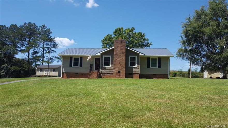 This spacious home is loaded with recent upgrades.  Vinyl siding, metal roof and gutters are all less than 1 year old.  All new stainless steel appliances remain- Samsung range, over the range microwave, refrigerator and dishwasher.  LG washer and dryer.  New central HVAC in 2017.  Windows have a lifetime warranty.  Nearly new 16x24 storage building.  Mater suite with WIC.  Living room with beautiful stone fireplace.  Great location-convenient to Union county.  Move in ready!  Must see!