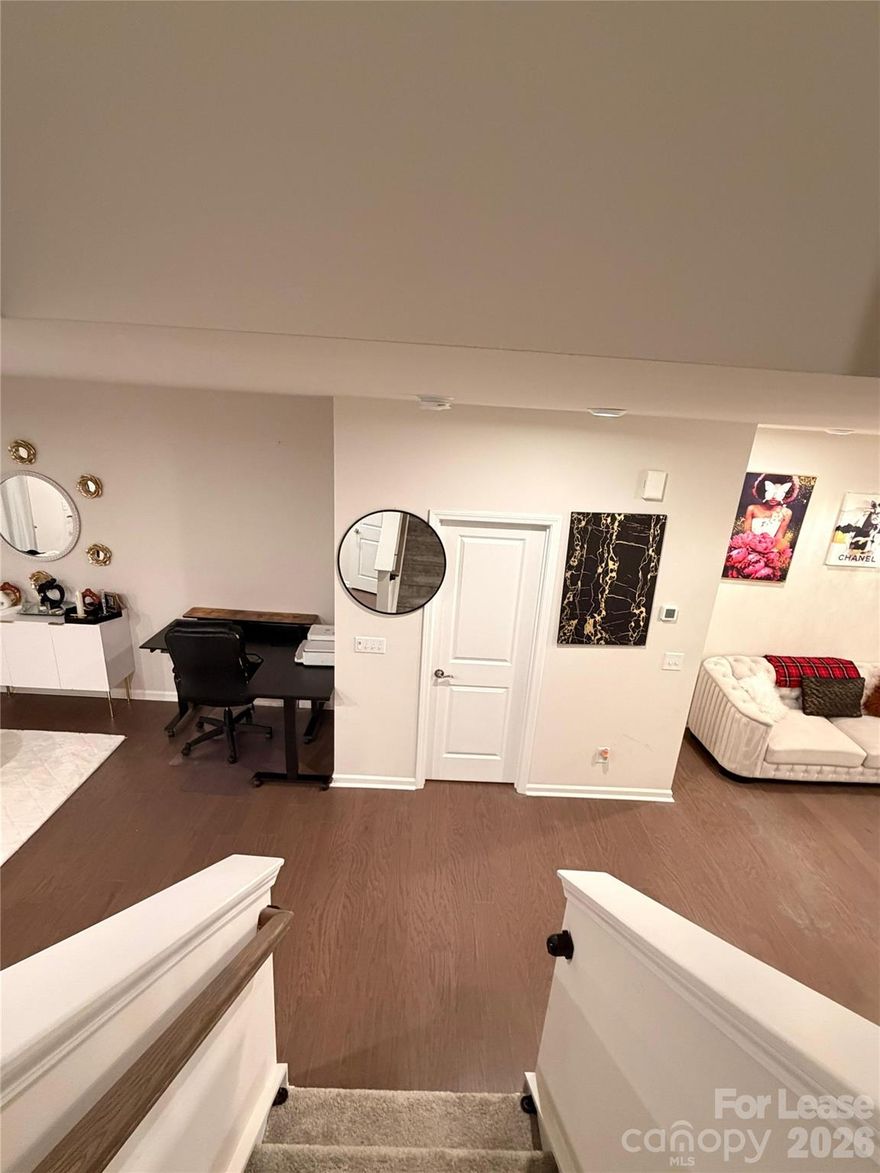 Welcome to Fifteen 15 Cannon! This modern two-story townhouse features 2 bedrooms, 2.5 bathrooms, and a one-car garage. The entryway leads into a spacious family room with elegant wide-plank hardwood floors, flowing seamlessly into the dining area and kitchen. The kitchen offers a walk-in pantry and a sliding glass door that opens to a large back patio—perfect for entertaining. The main level also includes a bright breakfast area, a convenient half bath, and a drop zone just off the garage.
Upstairs, you’ll find a generous hallway, a laundry area with a high-end washer and dryer, and a linen closet for added storage. The primary suite boasts a large walk-in closet and a private ensuite bath featuring a double vanity, a seated shower, and floor-to-ceiling tile. The secondary bedroom also includes a walk-in closet and easy access to a full bathroom with a tub/shower combination.
This new community offers scenic walking paths throughout and provides easy access to I-85, NoDa, UNCC, Uptown, as well as a variety of shopping and dining options.