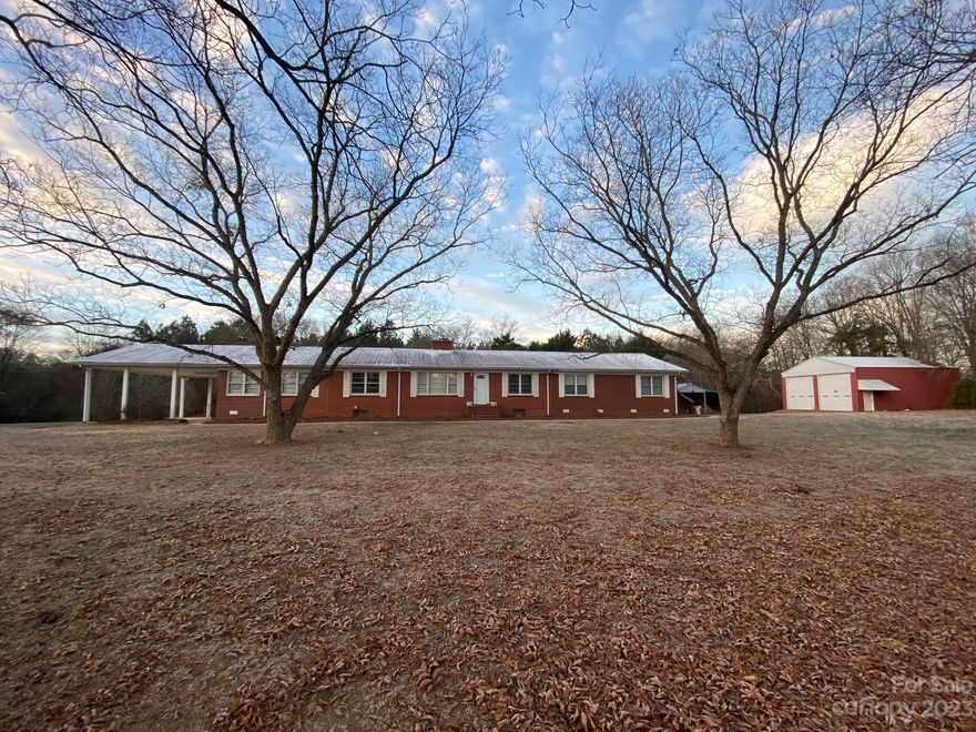 Brick home on a hill with over 26 acres of land, located in Peachland! Comes with two buildings. Red building is 40X30 with 14ft ceiling. Grey building is 50X30. Both have power, roll up doors and concrete floors. Gated paved driveway and attached DBL carport. All rooms are on the main level. Basement can be accessed from inside and outside of the home. Home has two HVAC systems and both were just replaced. Small field in the front of the property is great for gardening. Mature pine and hardwoods on the rest of the property. Huge 20X20 primary bedroom with a walk in closet and large bath with a tile shower and a garden tub. This property has a lot to offer, making wonderful memories is definitely one of them. Central heat and air for the entire home plus back up heat. Showings are by appointment only.