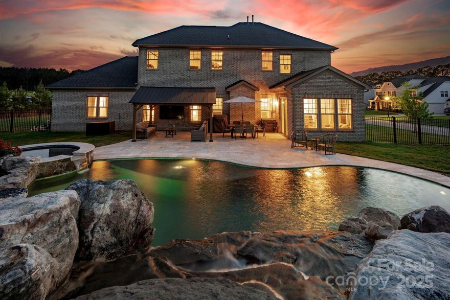 Welcome to this absolutely stunning home, where luxury living meets everyday comfort. Situated on over ¾ of an acre of flat, beautiful land, this property features a true backyard oasis with a heated saltwater pool, tranquil waterfall, and relaxing hot tub—perfect for entertaining or unwinding in your own private retreat. Inside, the open floor plan offers a seamless flow, with every room feeling spacious and inviting. The modern kitchen is a showstopper, featuring clean two-tone cabinetry, stainless steel appliances, a sleek backsplash, and direct access to the sunroom and living room, all with breathtaking views of the pool. The primary suite is oversized and serene, complete with a double vanity and an upgraded walk-in shower for a spa-like experience. A versatile bonus room offers the perfect space for a theater, game room, or home office. The home also includes a pristine 3-car garage with epoxy floors. Designed for entertaining and creating lasting memories, one-of-a-kind home!