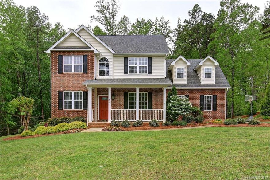 Move-in ready on 1.5+ ac. backing to woods & just minutes from Lake Norman State Park. Welcomed by "rocking chair" covered porch, charm continues inside w/hardwood floors throughout main-level living area. Office on main w/french doors. Large kitchen w/designer cream "glazed" cabinets, granite, stainless appliances & breakfast bar. Large master suite w/garden tub, double-bowl vanity &  shower. Large bonus room or 4th bedroom. Home freshly painted/new carpet. Appliances convey. Hurry!