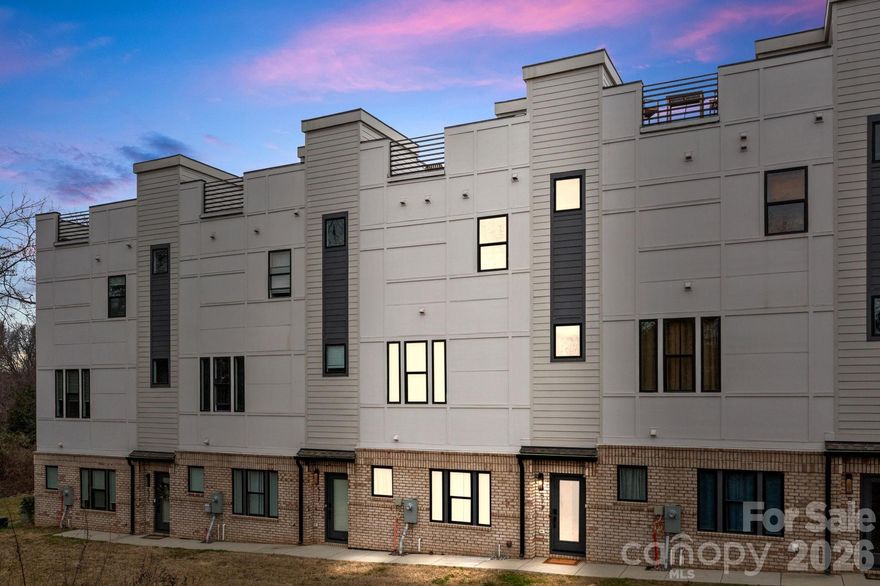 Sophisticated, Walkable Living in the heart of Charlotte's Belmont neighborhood! Built in 2023 by Copper Builders, this luxury 3BR/3.5BA townhome in Skyline Townes offers 1,720 heated sq ft of thoughtfully designed modern living just minutes from Uptown, NoDa, and Plaza Midwood. This Highland model townhome features a wider floor plan, high-end finishes, and clean architectural design throughout. The open-concept main living area flows seamlessly, making it ideal for both everyday living and entertaining. The kitchen showcases quartz countertops, two-tone cabinetry, stainless steel appliances, and designer lighting, while durable LVP flooring runs throughout the entire home.

A rare side-by-side 2-car garage with a 240V EV charging outlet adds everyday convenience, an uncommon find for in-town living. Zoned HVAC, and smart upgrades including CAT6 wiring and fiber internet support today's lifestyle needs. The true showstopper is the nearly 600 sq ft rooftop terrace designed for entertaining with unobstructed Charlotte skyline views, perfect for hosting, relaxing, or enjoying sunset evenings. Pre-wired for an outdoor TV and living space.

Located in one of Charlotte's most walkable and vibrant neighborhoods, you're just steps to Alexander Street Park (tennis courts and sports field), the Little Sugar Creek Greenway, Optimist Hall, breweries, restaurants, and local favorites like ACE No. 3 and Sweet Lew's BBQ (best brisket in the Charlotte). Easy access to I-277, I-77, I-85, light rail, and Uptown makes commuting effortless.

Flexible HOA allows both short-term and long-term rentals, ideal for a primary residence, second home, or investment opportunity. Small 21-unit community. Additional highlights include premium soundproofing between units, motorized shades, upgraded LED lighting, and a transferable 10-year structural warranty. This townhome delivers the perfect blend of modern construction, walkability, location, and lifestyle in Charlotte's highly sought-after Belmont corridor.