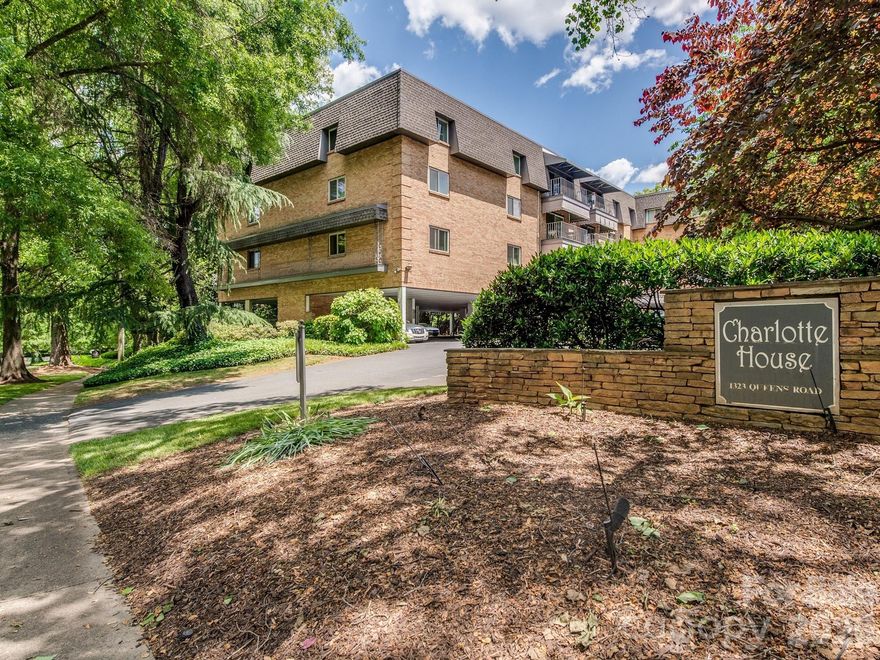 Charlotte House is a classic condo complex located in the heart of Myers Park. This desirable end unit features an open-concept kitchen equipped with granite countertops, natural wood cabinets, and a breakfast bar, seamlessly connecting to a dining area and spacious living room with a sliding glass door leading to a private balcony. The 2-bedroom, 2-bath unit boasts hardwood flooring in the living areas and tile flooring in the bathrooms. Thanks to its end-unit location, the primary bedroom receives ample natural light and includes a walk-in closet, a vanity/dressing area with built-in cabinetry, and a separate bathroom with a shower. Residents can enjoy amenities such as an outdoor pool and a common lounge area that features a gas fireplace, a comfortable seating area, a large dining table, and a wet bar, perfect for social gatherings.