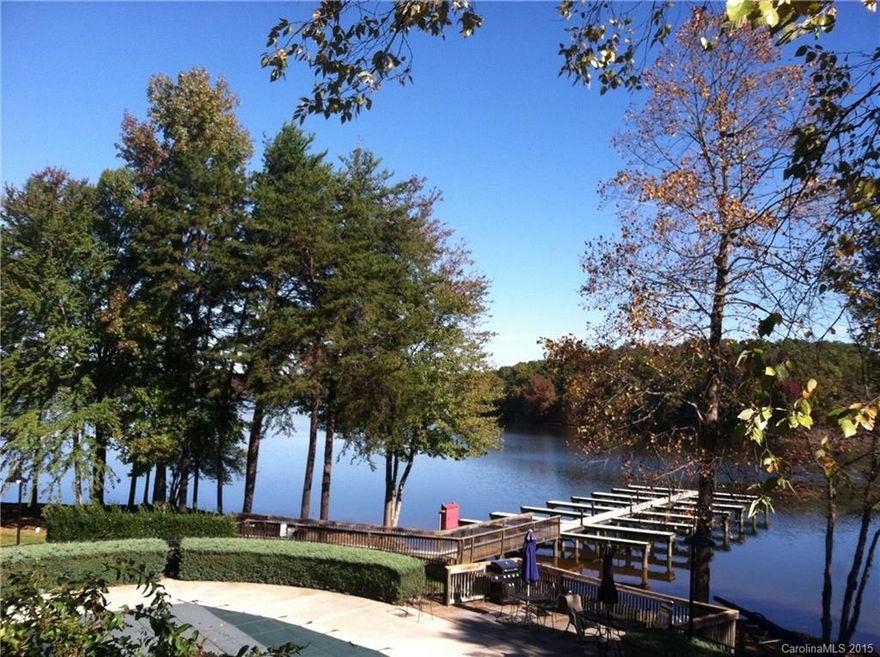 Superb location for serene lakefront living!  Very few 3BR end-units are perfectly situated both on Lake Davidson & next to the waterfront pool & rarely do they come on the market. This beautiful & spacious 2nd fl end-unit has wonderful views from numerous windows & 2 spacious covered porches, an elevator right outside the front door, gleaming wood floor in LR/DR, gorgeous kitchen granite & fixtures, lots of storage including an outdoor closet. Great access to I-77 & charming downtown Davidson.