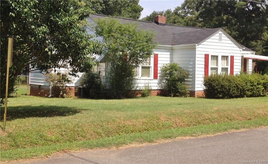 Double lot - Fenced yard - great location Close to restaurants, shopping, hospital.  Seller just completed painting. Fireplace is not currently operable