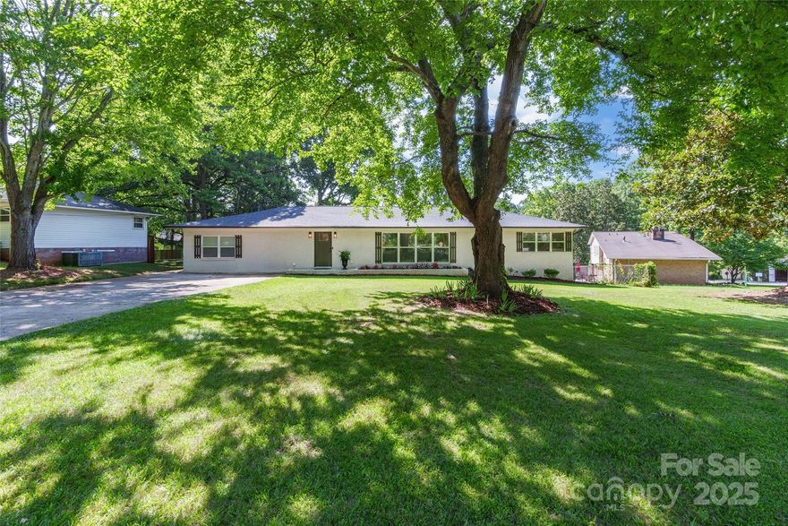Modern comfort and style in this beautifully updated ranch home, perfectly situated in a desirable Rock Hill neighborhood. This lovely residence offers a seamless blend of classic charm and contemporary finishes. Upon entry, you'll find a welcoming great room, bathed in natural light thanks to an abundance of windows adorned with 2" white blinds. The stunning kitchen features granite countertops, designer tile backsplash, and stainless steel appliances. Island with bar seating & a generous dining area provide ideal spaces for meals and conversations. Bonus/flex space off kitchen. Bathrooms have been tastefully updated with granite countertops and elegant tile, while the primary bathroom boasts a walk-in shower with a rain-head showerhead. Outdoor living is a dream with a spacious, fenced lot providing privacy and room to play, large back patio—perfect for relaxation and entertaining. HVAC and roof have been recently updated.