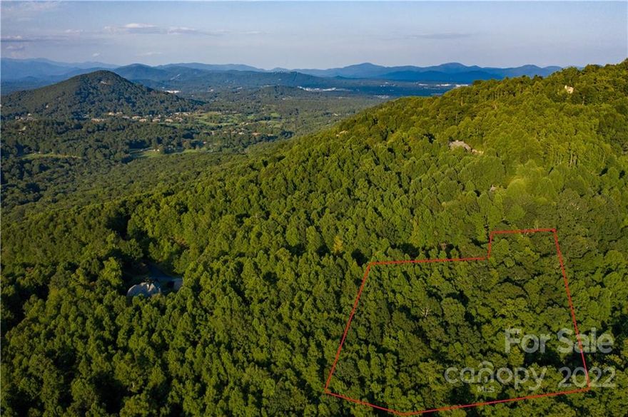 Approved 3 BR septic. 2.64 acres of west/southwest facing, sloped, mtn view, at the end of a cul-de-sac in quiet and established, 300 acre Avery Creek community. End of cul-de-sac lot offers privacy and easy driveway access to potential homesite. Slope is perfect for a walk-out day basement & decks to watch the sunset from. This combined/double lot is nestled at the end of a quiet country road in Walnut Cove just past the exclusive Cliffs at Walnut Cove community. Surrounded by Pisgah National Forest, with private community trailhead access to hiking and mountain biking trails leading to Mills River and Bent Creek recreation areas. This is the perfect spot for outdoor enthusiasts due to access and proximity to popular trailheads of Bent Creek, Mills River, and Turkey Pen. The community features a swimming pool, tennis & pickleball court, picnic shelter, hiking trails, and a stocked fishing pond. Less than 15 minutes to shopping, dining, and entertainment at Biltmore Park/S. Asheville.