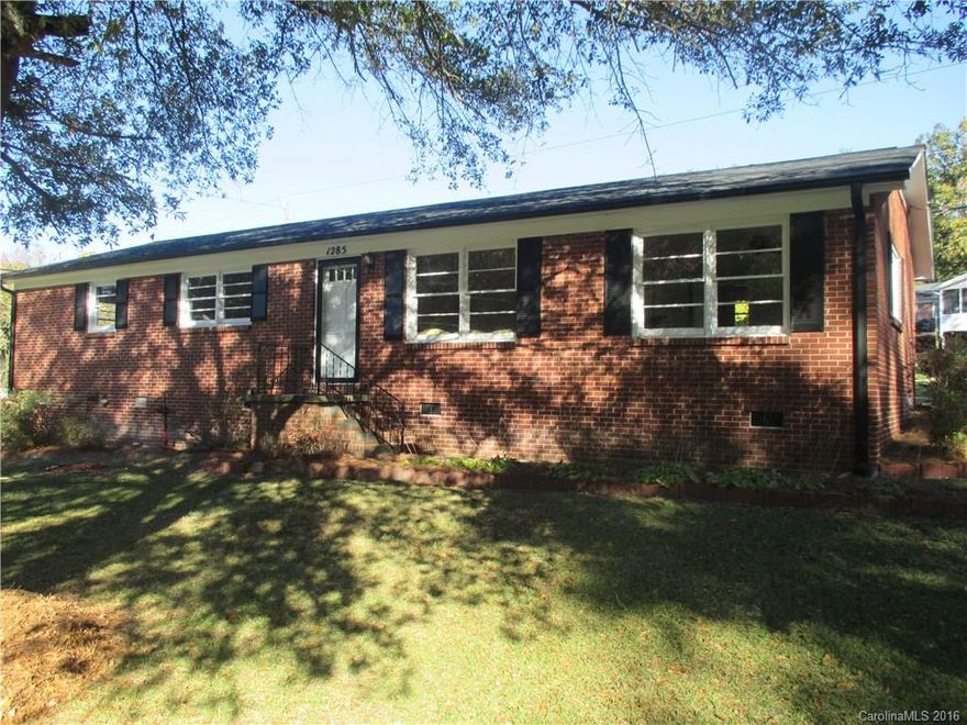 This 3 bedroom all brick ranch is cute as a button !!!  New agreeable grey paint and white trim throughout.  Real hardwood floors, nice size closets and spacious rooms !!! There is a newer roof installed in 2012.  The outdoor storage building is great for tools and storage.  Lots of land with this home.  The lot to the right of the home is part of the sale.  Nice wooded lot for privacy.  This home is move in ready and close to 77 access. It is a must see before it is gone !!!
