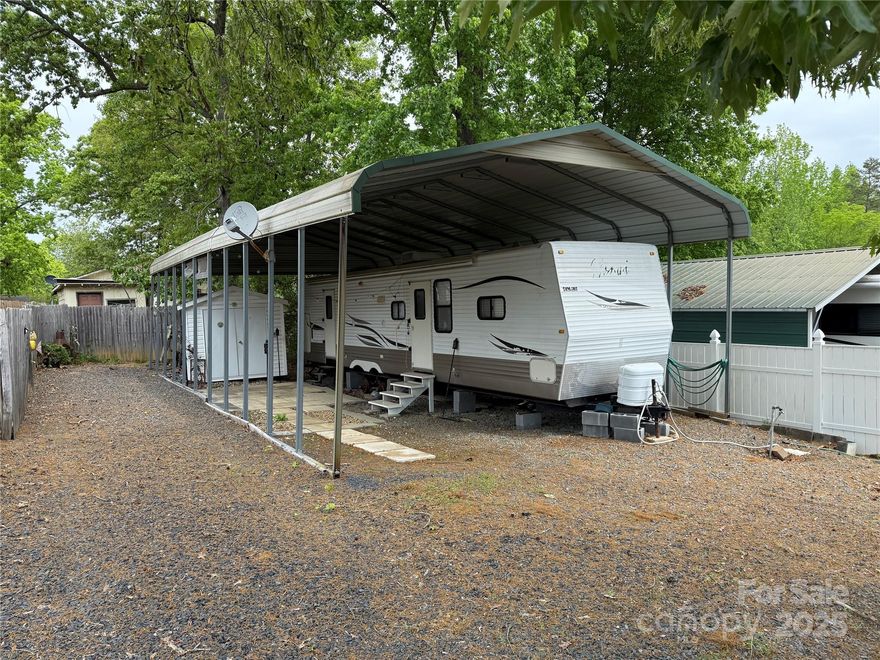 2009 Nomad 37' camper with 2 slides. Queen in main and 3 bunks in the bunk room. Metal carport over camper. Plenty of parking for all your toys. 10x8 Storage building with power. Tons of storage throughout. Come and see if this could be your "Happy Place" here in the park. The lot next door is for sale as well if you wanted 2 side by side. Bottle to camper, bill of sale will be provided. All clients must be with a realtor to gain access to the community.

Camper only for $6k
Lot only for $70k