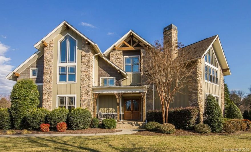 This fabulous custom built home sits on a large lot with seasonal water views. Features include a gourmet kitchen with top of the line appliances, great room with stone fireplace, luxurious master suite, 1st floor guest room with private bath, 2 addtitional guest rooms and huge bonus room on upper level, front porch, 3 car garage, and screened porch overlooking the beautifully landscaped yard. Boat slip is very conveniently located at the end of Heathland. A MUST SEE TO APPRECIATE.