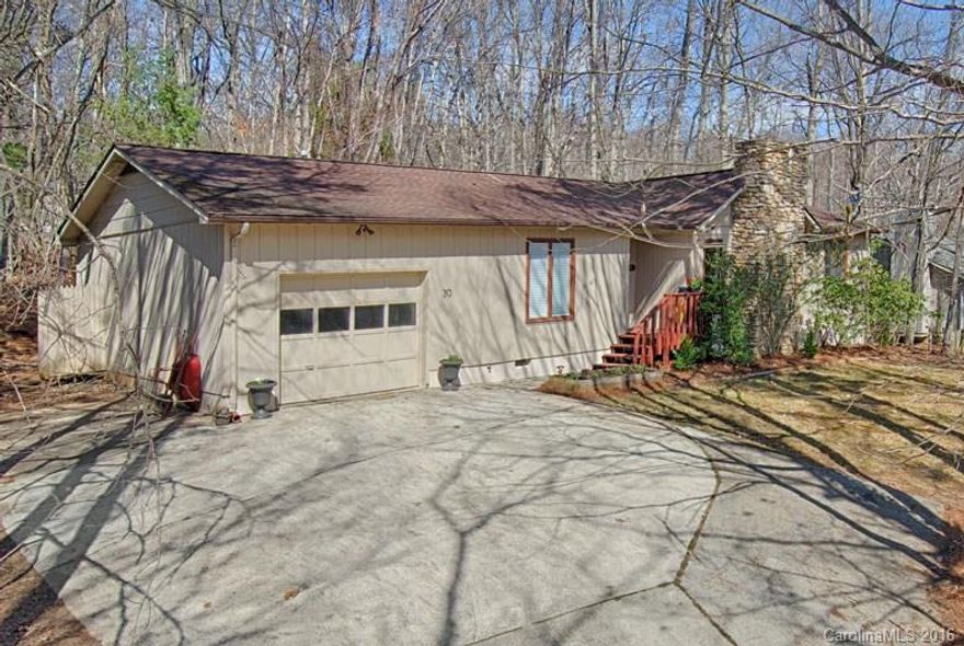 Lovely South Asheville home in a fantastic school district with a tranquil wooded setting yet convenient to tons of dining and shopping. Features include a one-level split bedroom floorplan, master suite, Brazilian Cherry and ceramic tile floors, oversize one car garage, stainless kitchen and a gas fireplace with a river rock hearth.  Patio and fenced private yard make this home great for entertaining. Updated with new lighting, fresh paint, energy upgrades and more! See brochure for details.