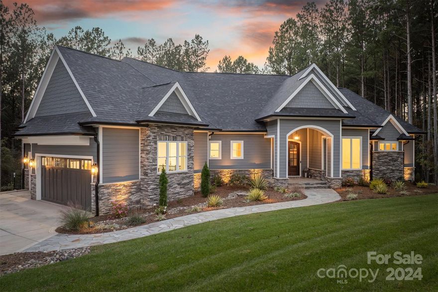 Welcome to 1253 Cordova Drive, a stunning custom-built home in the gated community of Paradise Harbor. This gem features a deeded boat slip for easy access to serene waters. Inside, you'll find high-end finishes throughout, including vaulted ceilings, hardwood floors, and exquisite details like crystal doorknobs, detailed crown molding, and extensive trim work. The gourmet kitchen is a chef's dream, showcasing top-of-the-line Bosch appliances and luxurious quartz countertops, flowing seamlessly into the picturesque dining room. Bedrooms are thoughtfully placed on opposite sides of the home for privacy. The primary bath boasts breathtaking finishes and two spacious walk-in closets. Entertainment is a breeze with a wet bar in the walkout basement and a hidden bonus room behind a bookcase door. Modern conveniences include a 12-camera security system, Sonos speakers, smart thermostats, motorized blinds, screened-in porch, 3 car garage with 3 50amp EV outlets, and a full irrigation system.