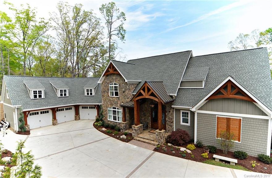 Every detail in this custom waterfront home is breathtaking.  Travertine & wood floors, natural stone & exposed beams! Gourmet chefs kitchen is a dream with subzero fridge, double oven, massive island and huge walk-in pantry. Vaulted ceilings in living rm, master bedroom. Master bathroom features walk-in shower, wooden sink bowls, and copper clawfoot tub.  Living edge wood counters in bathroom. Open the folding glass wall to the back porch for entertaining in the outdoor kitchen.