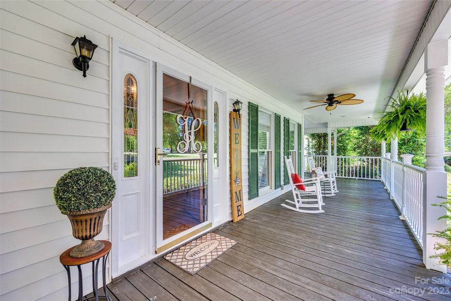 $10,000 in Buydown/Closing Cost Credit available with accepted offer. Prepare to fall in love with this 4-bedroom, 2.5-bath home, which offers a blissful escape from the hustle & bustle of everyday life. As you approach, be greeted by the inviting wrap-around front porch, beckoning you to sit back & savor the beauty that surrounds you. Step inside and you'll notice the warm embrace of hardwood floors in the living & dining rooms. The well-appointed kitchen features a spacious island, ample cabinet space, and modern appliances. The main level primary bedroom boasts a generously sized ensuite bathroom. An additional bedroom or office on the first floor offers versatility to suit your needs. Two more large bedrooms & a full bath complete the upstairs. Enjoy the warmth of the sunroom, or step outside onto the large deck, perfect for enjoying your 7+ acre private retreat. The encapsulated crawlspace ensures a dry foundation, while the wired shed offers additional storage & workshop space.