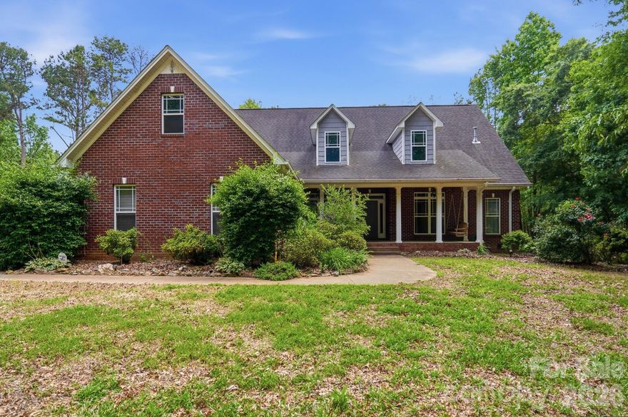 Escape to privacy and comfort in this beautifully maintained 4-bedroom, 2-bath brick home set on 13 serene acres. Surrounded by mature woods, this property balances peaceful seclusion with space to explore and enjoy.

Inside, you’ll find gleaming hardwood floors, a bright, open layout, and new stainless steel kitchen appliances. Step out to the screened-in porch or unwind under the pergola on the deck, perfect for morning coffee or evening gatherings. The unfinished walk-in attic space can be used for storage or made into a game room or bonus room. There are endless possibilities. 

Modern upgrades include solar panels, a self-heating carbon filtration system, Leaf Guard gutters, and a generator hookup—providing both efficiency and ease of living. Whether you’re looking for a private retreat or a place to spread out and entertain, this unique property combines timeless craftsmanship with smart sustainability.

A rare find—private, practical, and ready to welcome you home.