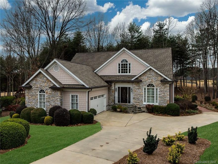 Nestled on a wooded .65 acre, this perfectly sized home is cited between holes 2 and 3 of The Peninsula Golf Course on Lake Norman. Lovely main floor master has his & hers closets, updated bath w/free standing tub & seamless shower. Work from home in the main floor office w/French doors. Gourmet kitchen w/Wolf commercial range and stainless appliances opens to breakfast room & great room w/warming fireplace. Enjoy entertaining on the huge covered porch. New upgraded carpet throughout. Perfect!