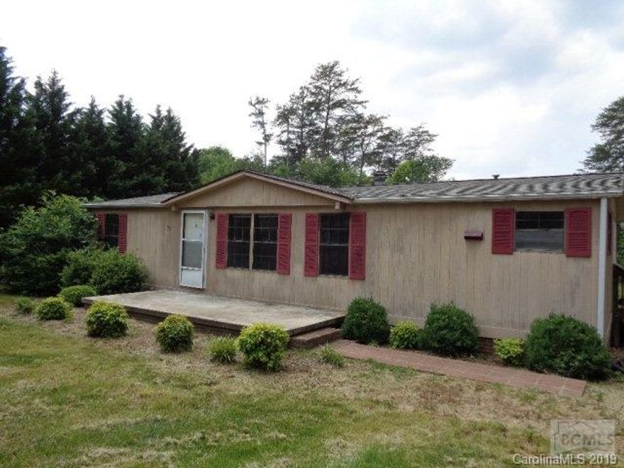 Double wide with large yard, lots of privacy, large concrete patio and fireplace in living room. Outside A/C unit missing. All offers must be submitted at www.xome.com. Auction July 16th-19th. Nonrefundable $2500 buyers premium fee charged and added to winning bid.