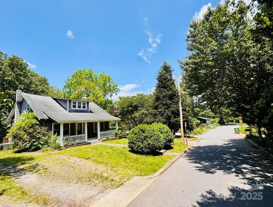 Built in 1925 during Asheville’s Arts & Crafts boom, this bungalow reflects a movement rooted in simplicity, craftsmanship, and connection to nature. Many homes of this era followed a story-and-a-half design—compact yet efficient, with thoughtful use of space and rich architectural detail. This home retains key original features: five-panel doors, heart pine floors, plaster walls, picture rails, and tall ceilings, all largely untouched by modern overhauls. While it will need updates, its beauty lies in what hasn’t been altered. The finished attic, not counted in heated SF due to ceiling height, offers two bonus rooms and a half bath. Practical upgrades like an architectural roof, central cooling, and encapsulated basement are already done. A second lot behind the home is included in this offering, addressed on Academy offers great future flexibility, but the true value lies in this home’s authenticity—a rare survivor of Asheville’s handcrafted past. House without lot MLS#4268419