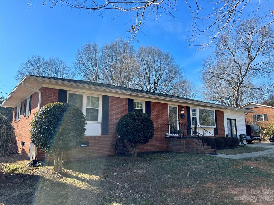 Beautiful solid brick ranch with 3 bedrooms, 1 full bath and 2 half baths. Enjoy refinished hardwoods in the living room, bedrooms and hallway. Kitchen and bathrooms have been updated with luxury vinyl plank flooring. Freshly painted walls, interior doors, baseboard, crown and kitchen cabinets. Crown molding throughout home and chair rail in hallway. New granite countertops, backsplash and appliances in kitchen. New HVAC and roof. 12 x 26 Carport has been enclosed and converted into a home salon, adding a half bath and increasing the living space by over 300 square feet. Salon also features its own exterior entrance. Could be used as separate living area, Airbnb, workshop, office or fitness space moving forward. Large 10x20 covered back deck overlooking giant fenced backyard with a 6ft vinyl privacy fence and new concrete patio. Excellent Mooresville location. Within walking distance of Walmart and minutes to schools & shopping!