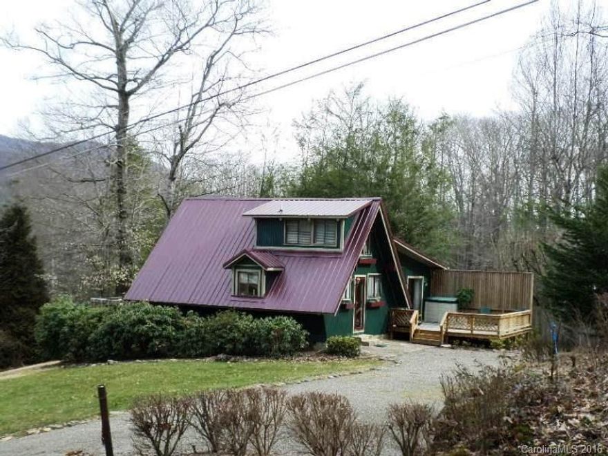 Cottage, A-frame, remodeled in 2012, floor to ceiling 2-story windows to mountain views. Large master bed & bath on main.  2nd bdrm & bath & laundry on main.  Loft 3rd bedroom-enclosed. Kitchen open to living room &  views. 16x16 back deck + front 20 x 12 deck, large-level driveway for lots of parking & turn-around space. Quiet setting with 2 streams on neighboring lots for relaxing sounds of water while enjoying the 2 decks! Well maintained & ready to move-in.  Just up the road from J Arthurs.