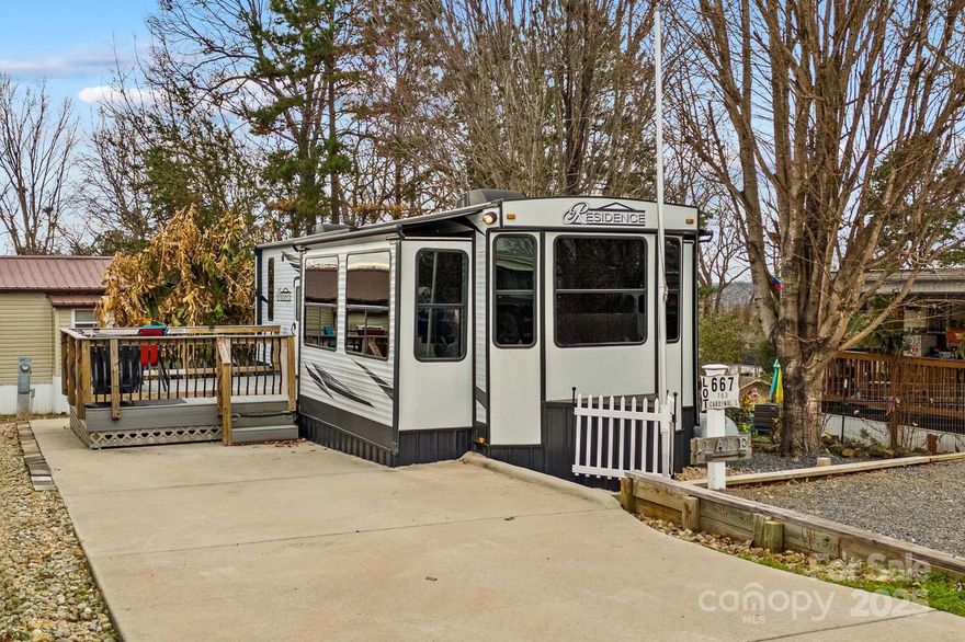 Escape to effortless lakeside living with this beautifully maintained 2021 destination camper, situated on a level, deeded lot in the sought-after Badin Shores Resort at Badin Lake. Designed for comfort and convenience, the camper features two bedrooms, one bath, stainless steel appliances, and a cozy electric fireplace—perfect for relaxing after a day on the water. Outside, a concrete parking pad and deck provide ideal space to unwind and take in the peaceful surroundings. Enjoy all the perks of resort living, including a swimming pool, fishing pier, basketball courts, boat ramp, putt-putt golf, clubhouse, playgrounds, and picnic pavilion. Whether you’re seeking a weekend retreat or a low-maintenance getaway, this charming lakeside property offers endless opportunities for recreation and relaxation