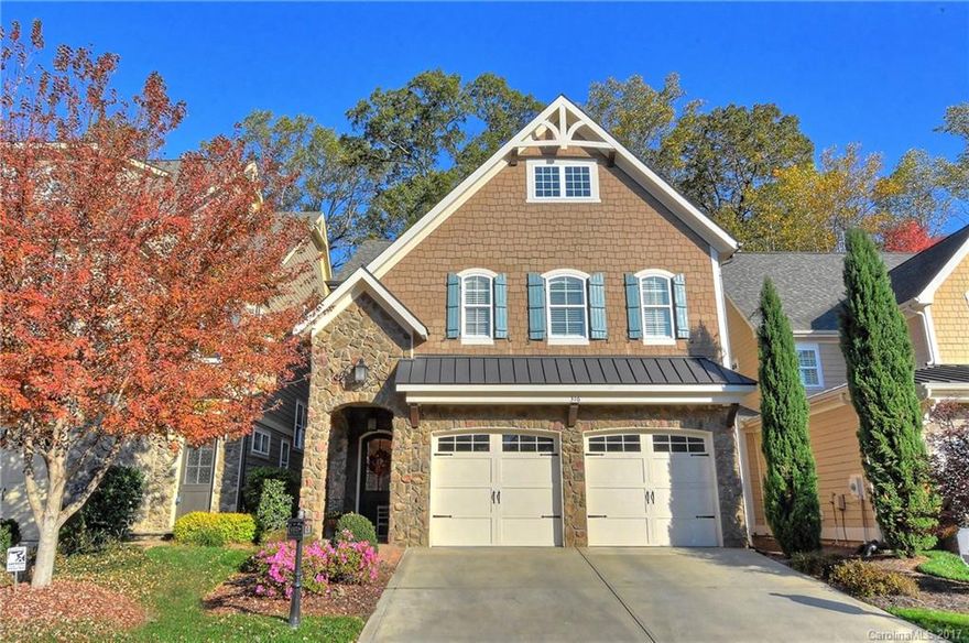 Simonini home upgraded with tasteful architectural features in exclusive gated community! Modifications for future elevator! Decorator window treatments, plantation shutters, crown molding, engineered hardwood floors throughout main & in upstairs hall & master! Expanded kitchen w/oversized island, beveled granite, upgraded cabinets, backsplash & lighting, upgraded KitchenAid refrigerator & "silent" dishwasher! Private patio, fenced backyard, garage w/epoxy flooring & custom cabinets! A MUST SEE!