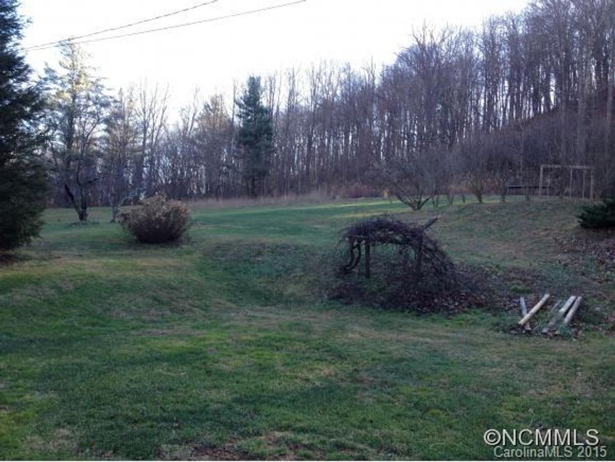Beautiful panoramic mountain views, end of road privacy above neighboring houses, one home allowed, no mobiles or commercial, level home-site with pastoral front and wooded backdrop to ridge-line, 1 mile from 74A and 5 miles to I-40. Taxes TBD, part of pin #  Plat Book 144 Page 69 Lot 4 is best legal discription. Price lowered $10,000.