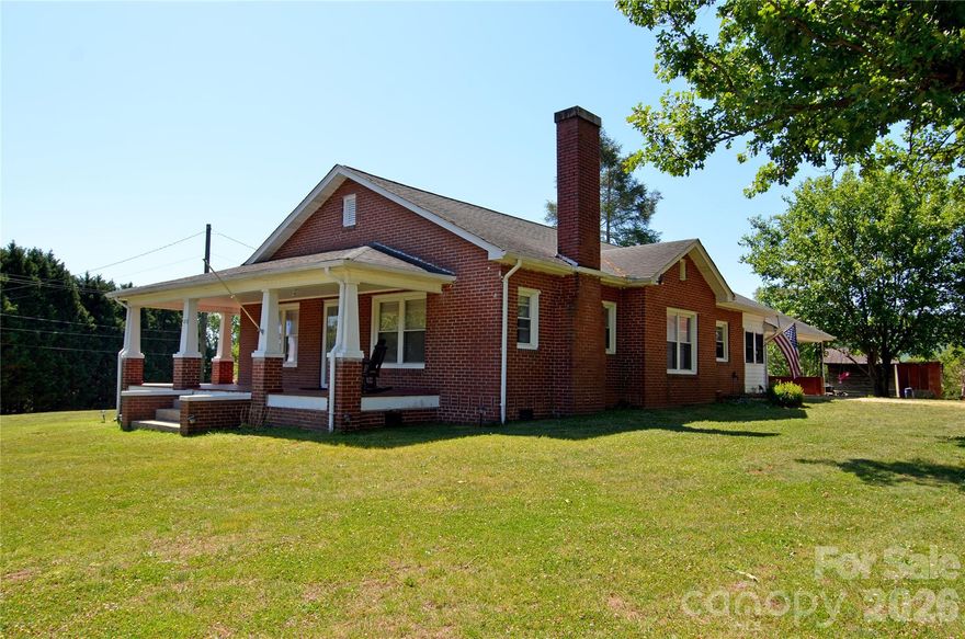 This charming 3-bedroom, 1-bath home offers classic character and plenty of space, situated outside city limits on a generous 0.72 acre lot plus an additional 0.22 acre parcel, perfect for a garage, camper or home. Inside you will find original hardwood flooring, beautiful built-ins, and classic french doors leading into the dining room, adding timeless appeal throughout the home. Enjoy relaxing mornings on the large covered front porch, while the one-car carport and spacious outbuilding provide extra convenience and storage. With room to spread out and plenty of potential, this property offers the perfect blend of country living and charm.