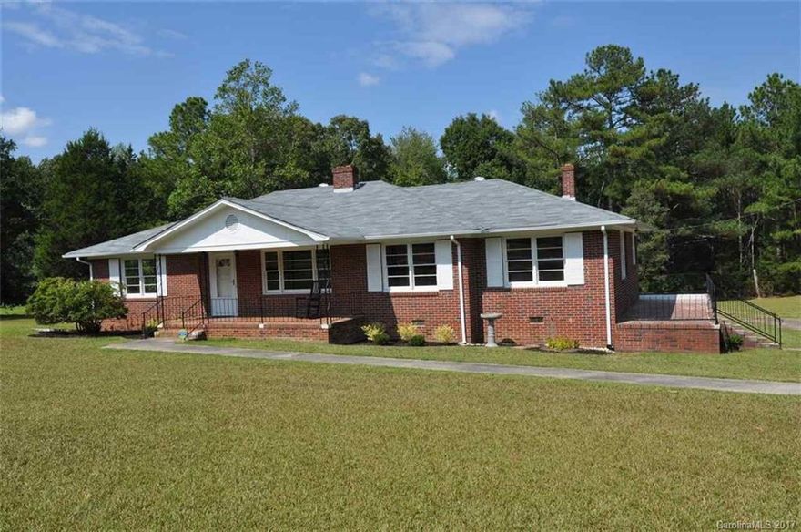 Country living at its best! Completely renovated 3BR/2BA, 1941 sqft, brick house on 2+ acres. Formal living room w/ fireplace, formal dining room, large den, spacious kitchen w/ appliances. Full laundry room w/ washer/dryer and space for a separate freezer. Restored hardwoods throughout, big bedrooms, tile in both bathrooms. Rocking chair front porch, side and back porch, perfect for relaxing or entertaining guests. Roof, HVAC, plumbing, & septic all replaced in 2017.