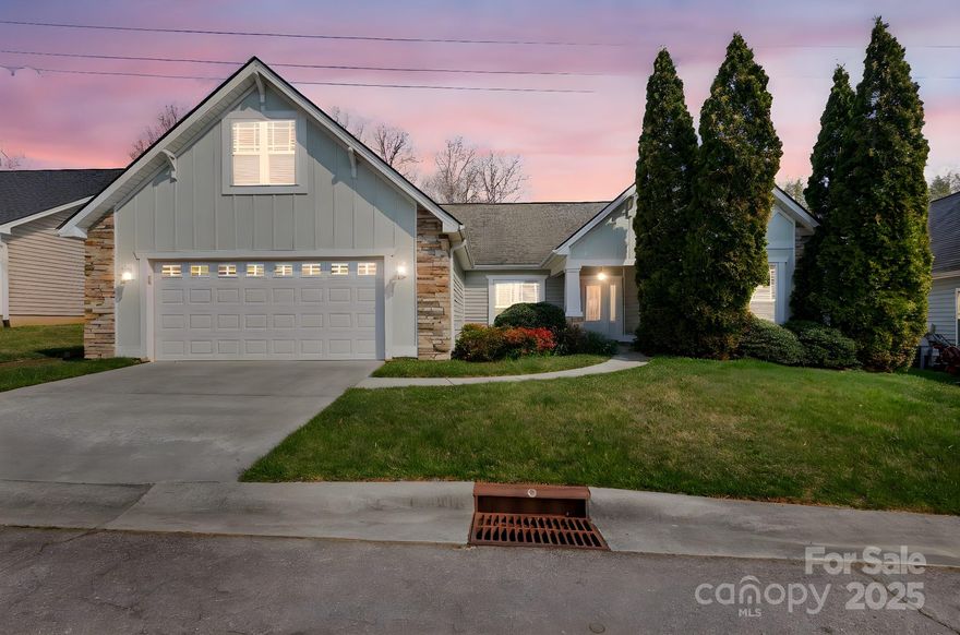 Interior has been repainted and the main living area has new flooring making it move in ready.  Attractive craftsman style, low maintenance cottage has attached double garage with FROG. Located in south Buncombe, county taxes, quaint small neighborhood. 5-7 mins. to shop, airport. Flat walking area. Split bedroom plan. Open great room to kitchen, dining room. Granite fireplace surround & hearth. 7 ceiling fans. Separate laundry room. 18x10 screen porch views private wooded border. (Great for birds) Award winning school district. FROG has separate HVAC system, Trane furnace (2020) and newer gas water heater (2021).