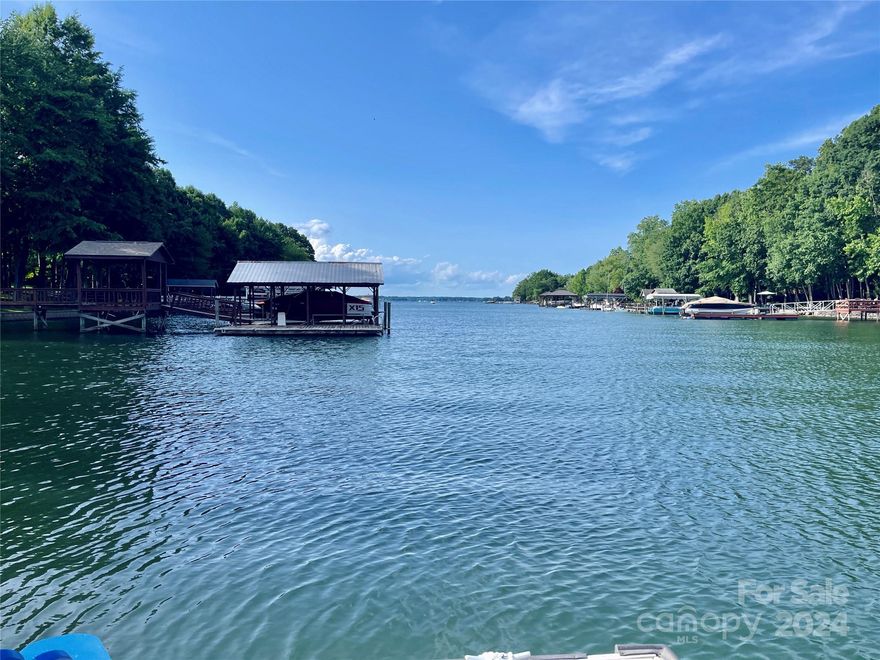 Completely renovated lake house (Southern Cottage Corp award winning luxury builder)Follow tree-lined drive into your private sanctuary, 1.2 acres to Lake Norman! Open plan vaulted ceiling in great room & stone fireplace, dining, kitchen, 10' island in kitchen, coffee bar, walk-in pantry, paneled ref-freezer, hardwood floors. Owners suite w/valued ceiling, fireplace & access to deck, bath w/separate vanities, storage tower, walk-in shower w/warming towel racks. His & her closet, wooden shelves & stack washer-dryer. Main level guest rm, en-suite & study area. Folding door opens to outdoor kitchen, peninsula bar, fridge drawers. Lower level has oversized 24x36 tiled floors, 1/2 bath & guest suite w/built-in bunks, bath. Large casual family room, concrete finish-fireplace, wine fridge w/glass door, wet bar-kitchen, laundry & oversized storage. Detached garage, connects by breezeway. Stone fire pit, covered slip/lift, jet ports. New windows, doors, shake roof. Start living the life today!