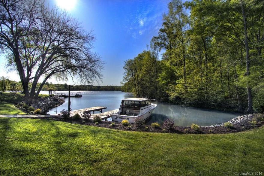 Come home to this exquisitely updated waterfront home which offers everything you could want in a home and more!  Great views can be enjoyed from deck or porch levels; over 100’ of waterfront & dock; Hardy plank siding w/plenty of stone accents; Enjoy the open floor plan, great rm w/vaulted ceiling, 2 story stone FP’ kitchen w/42” cabinets, granite counters & tile backsplash, large island w/brkfst bar & storage galore; bamboo flooring; private master suite, (The master suite is on the basement level.  This room does not have a window so we cant call it a bedroom. lower level great room w/wet bar, and the list goes on and on.  Every inch has been updated.  Check out the video tour or better yet, come over and soak up the atmosphere!  Located just minutes away from the Whitewater center and many other Charlotte area attractions.