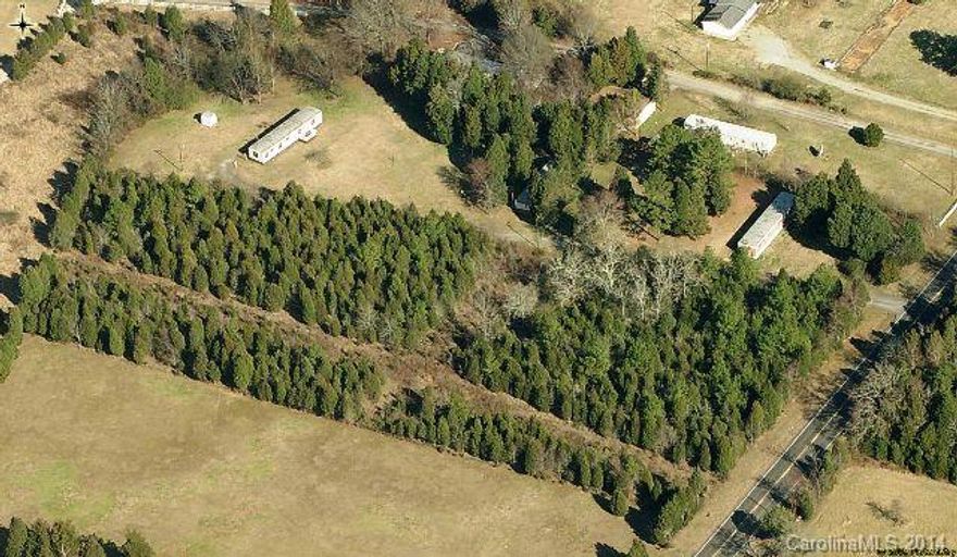 Wooded 3.2 acre lot perfect for mobile home, zoned RUD. Buyer to install well and septic. Tons of trees that can be harvested by buyer