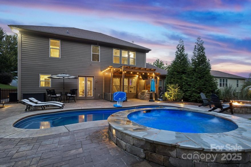 Welcome to this beautifully maintained 4BR/3.5BA home in the sought-after Preserve at Riverchase! The owner spared no expense with thoughtful upgrades inside and out. This spacious home features an open-concept layout, a stunning great room with a floor-to-ceiling stone fireplace, custom built-ins, and abundant natural light. The chef’s kitchen boasts a large island overlooking the main living area—perfect for entertaining. The main-level primary suite offers a spa-like bath and walk-in closet. Upstairs, a beautiful iron railing leads to a versatile loft, ideal for a media room, playroom, or family space. Three additional bedrooms include walk-in closets and two full baths, including a convenient Jack and Jill bathroom connecting two of the rooms. Step outside to your private backyard oasis with swaying palm trees, an in-ground pool, oversized hot tub, gas firepit, gazebo, built-in gas grill, and expansive paver patio—perfect for outdoor entertaining or relaxing in your own resort-style retreat. Award-winning schools and minutes to I-77!